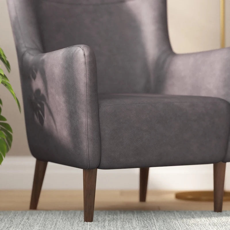 Fauteuil d'appoint capitonné à oreilles avec structure et pieds en bois